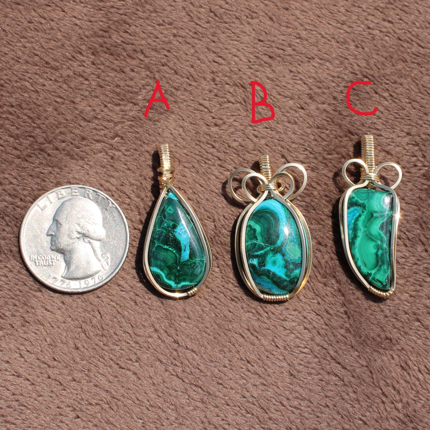 Three 14k Gold Filled Chrysocolla Malachite pendants labeled A B C next to a US quarter for size comparison