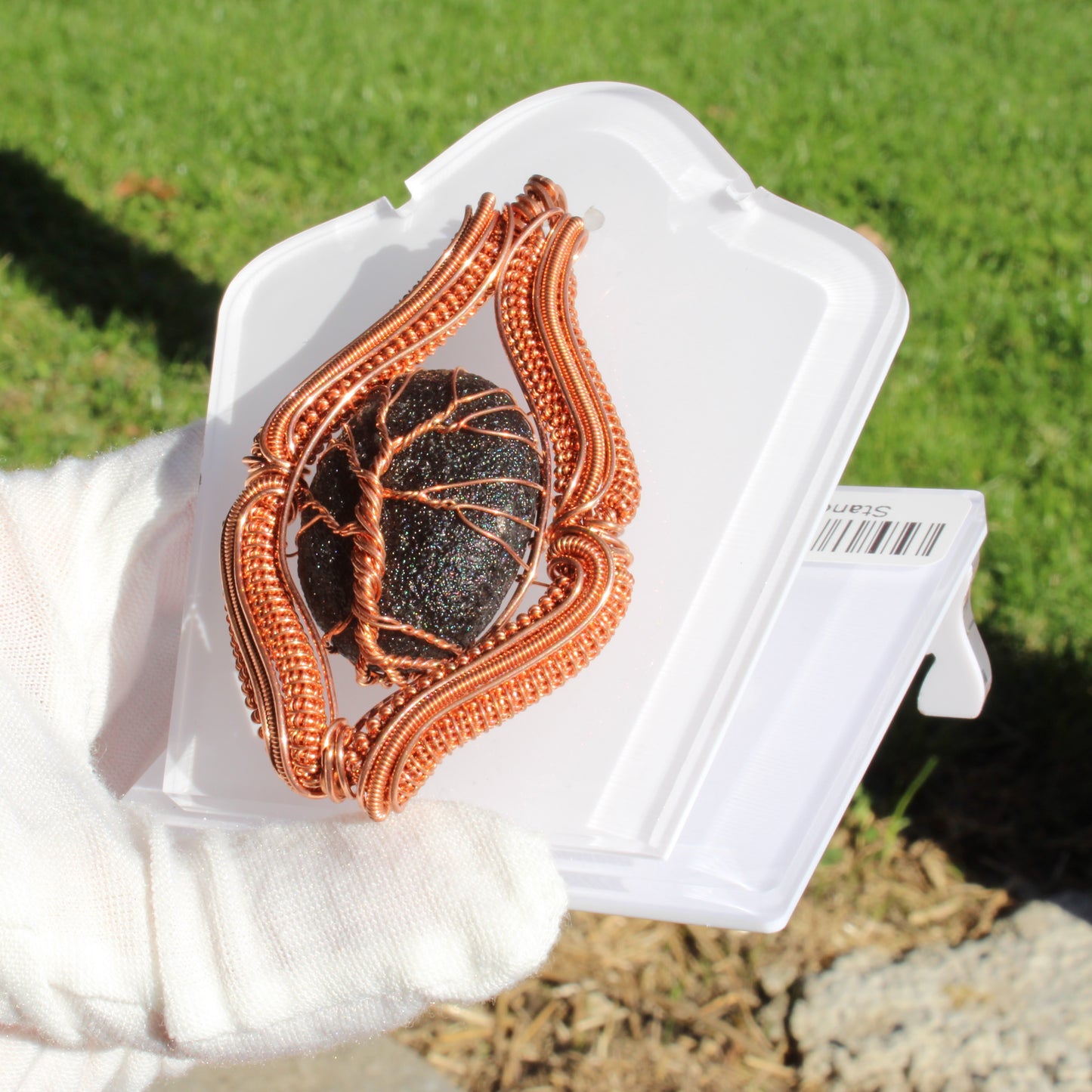 Agni Manitite Obsidian Pendant elegantly wrapped in copper on a display card for unique jewelry lovers