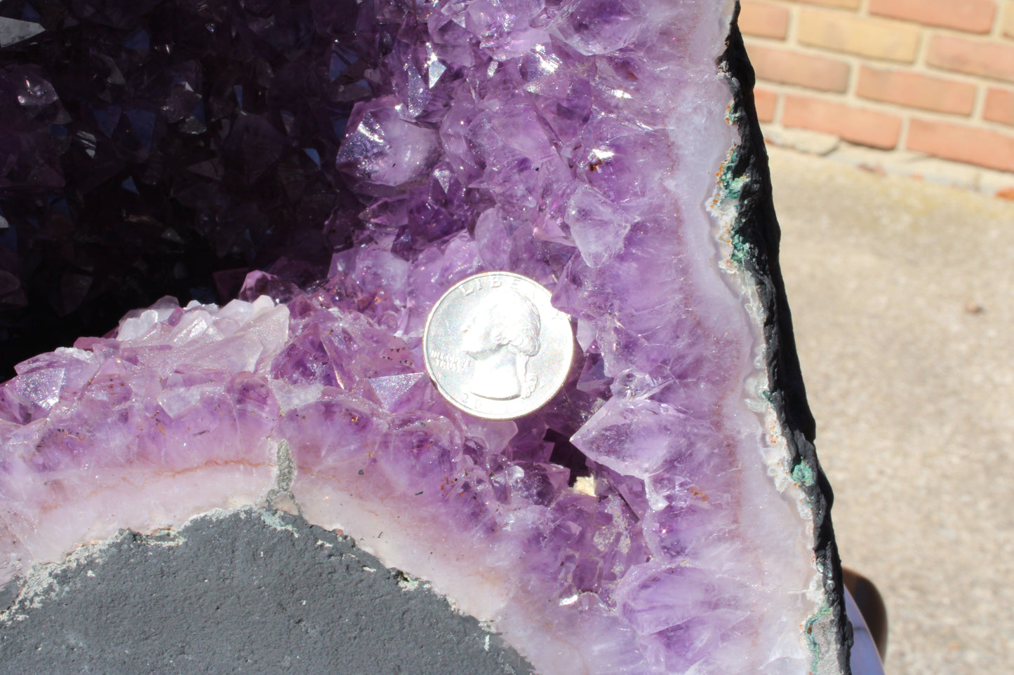 Amethyst Cathedral with purple crystals showcasing unique formations and a quarter for size reference