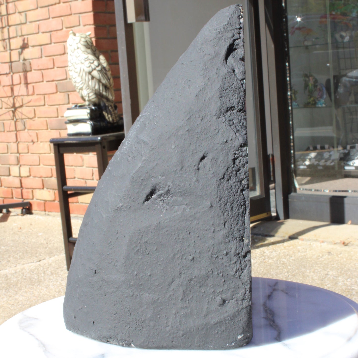Unique black crystal sculpture with a sleek design, ideal for home decor featuring an Amethyst Cathedral