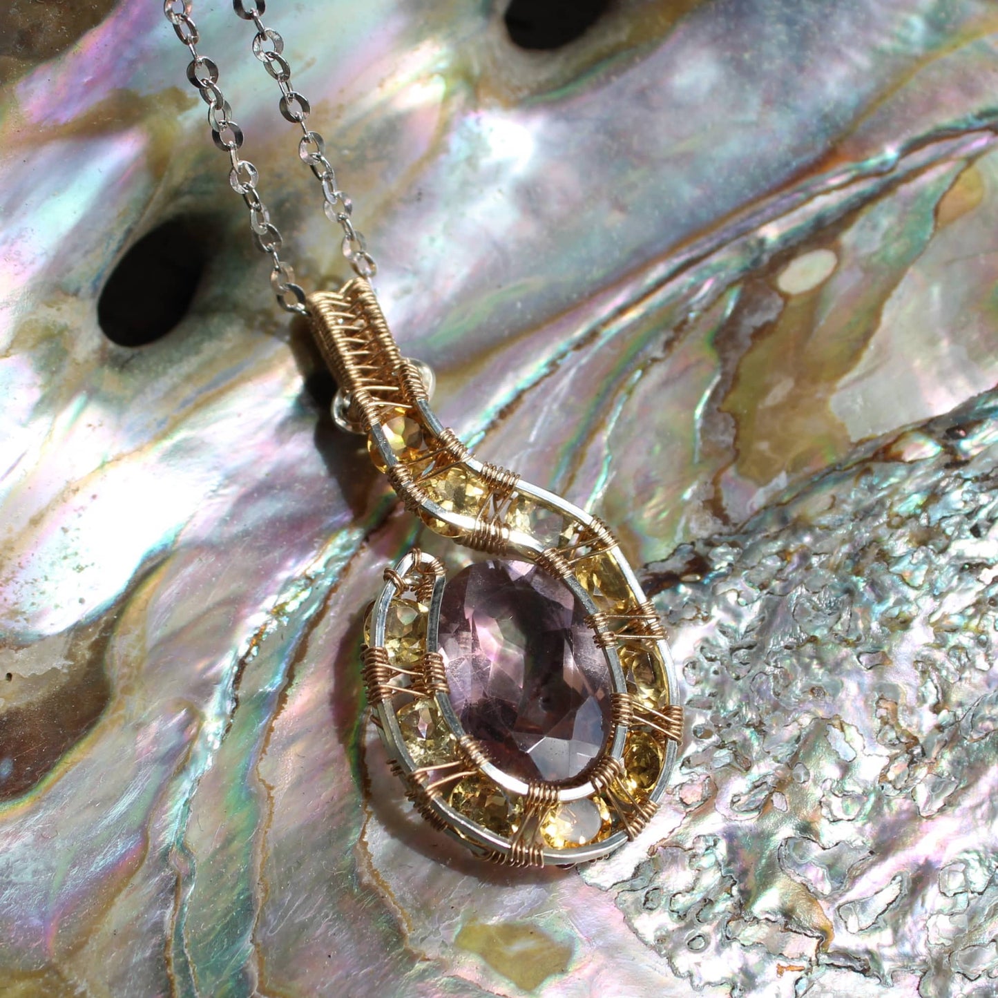 My Store Amethyst Citrine Pendant on a delicate silver chain with intricate wire wrapping design
