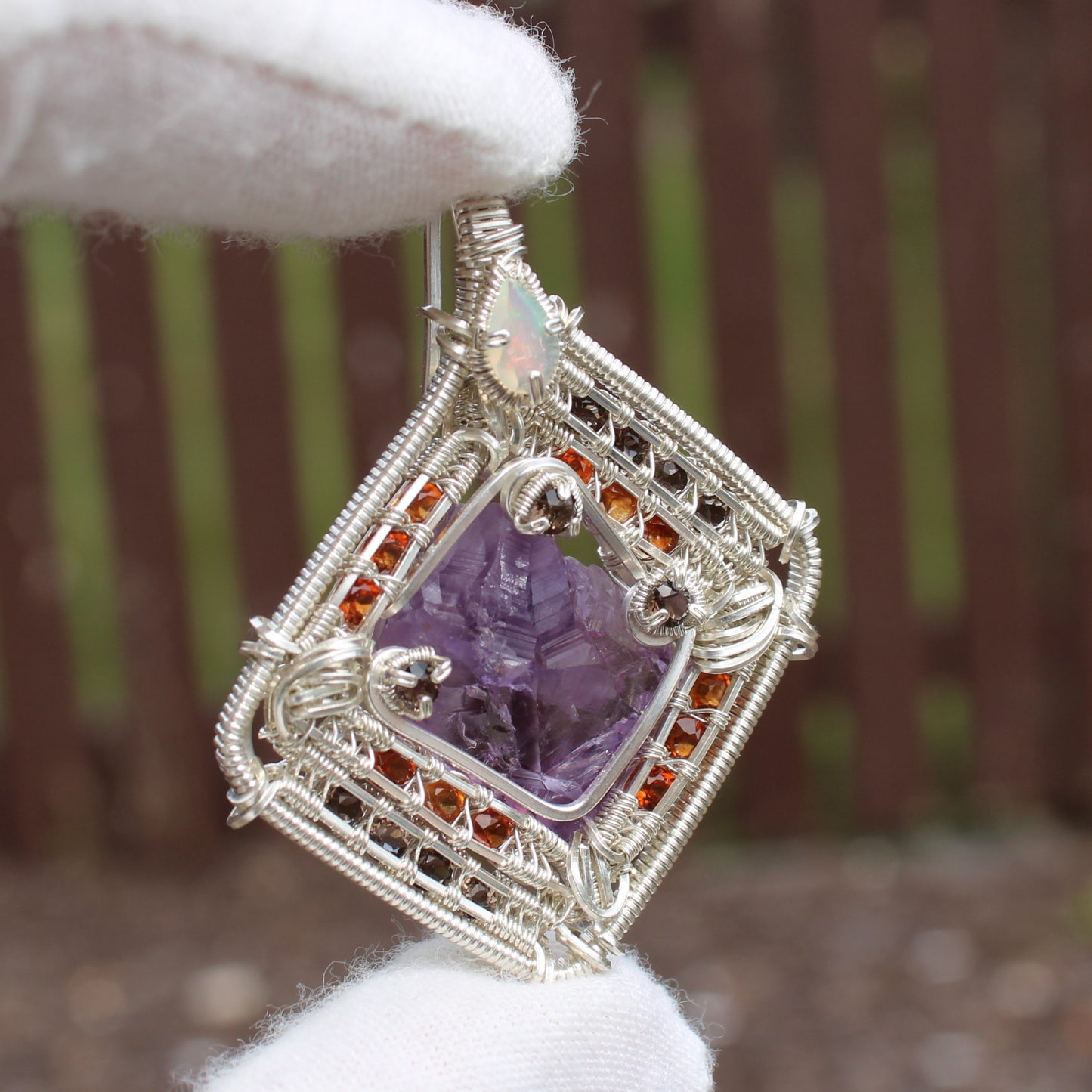 Handcrafted jewelry pendant featuring amethyst garnet opal silver wire wrap design by Different Branches LLC