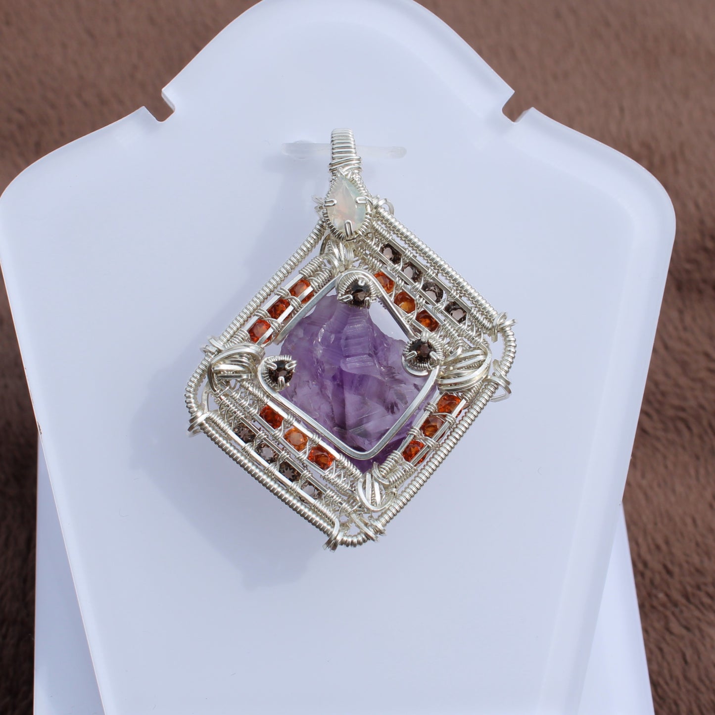 Intricate amethyst garnet opal silver pendant with wire wrapping by Different Branches LLC