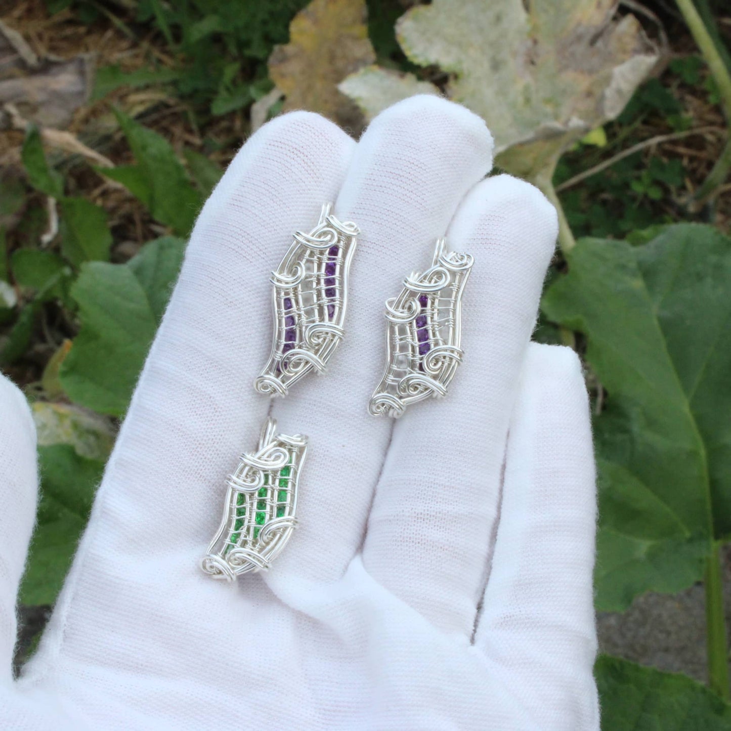 Sterling silver pendant showcasing Amethyst and Moonstone in an elegant wire design