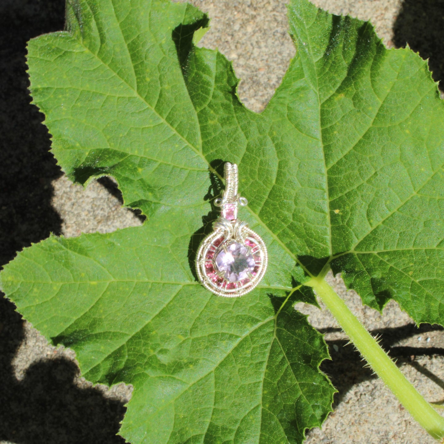 Stunning Amethyst Sterling Silver pendant with pink tourmaline stone on a green leaf