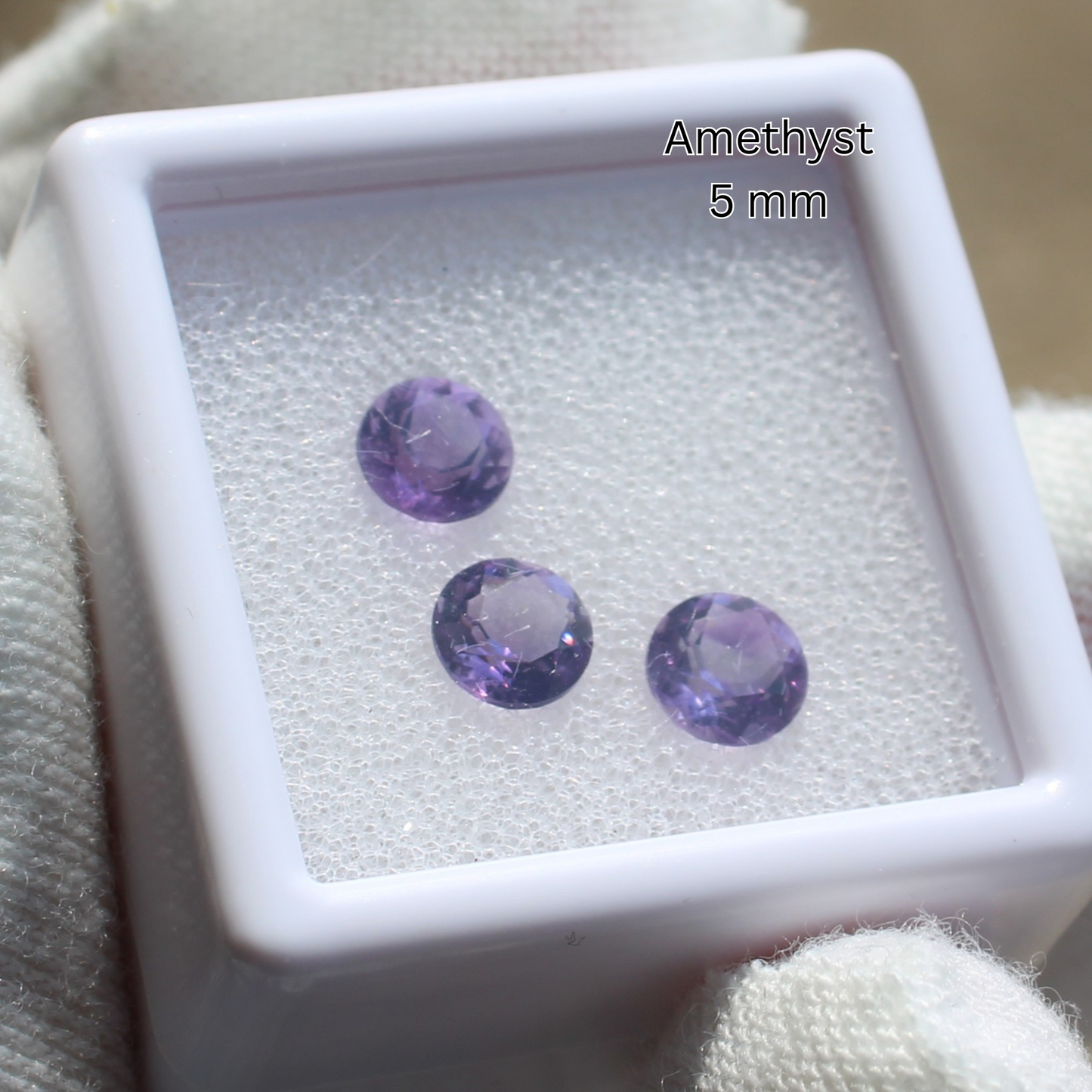 Made to order rings amethyst 5 mm round faceted crystals in white display box held with glove