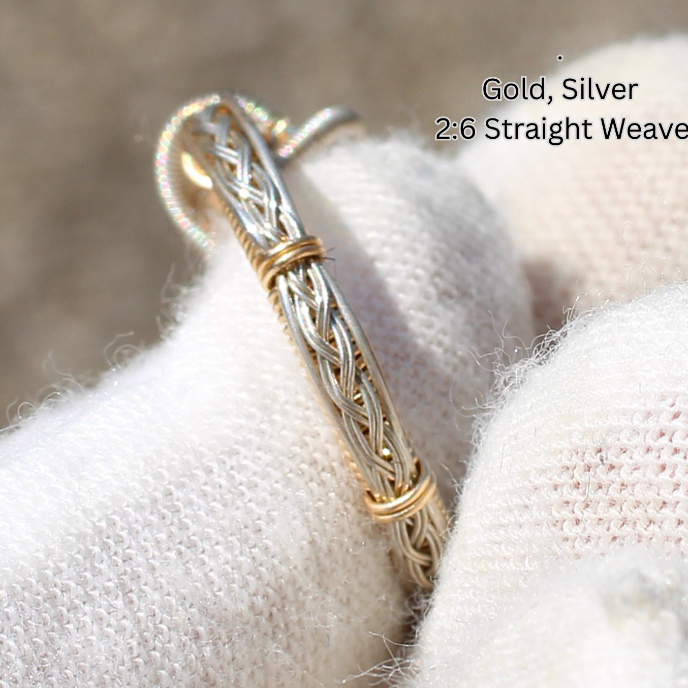 Handheld gold and silver woven wire ring held in white glove detailed wirework Made to order rings by Different Branches LLC