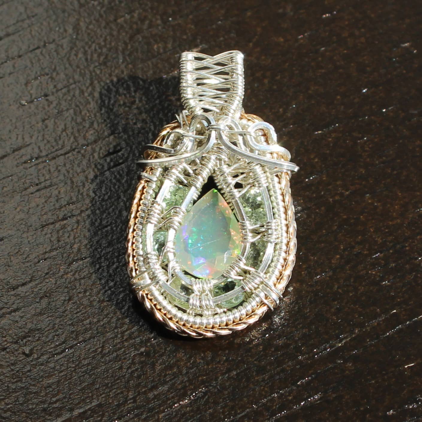 Artisan opal pendants Ohio featuring a stunning teardrop design wrapped in silver and gold wire