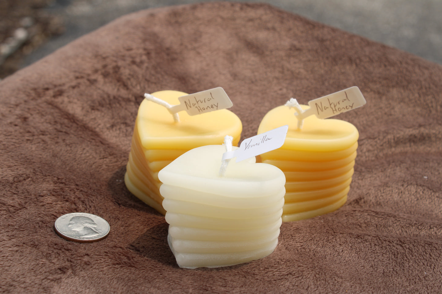Handmade beeswax heart candle in yellow and cream with unique layered design