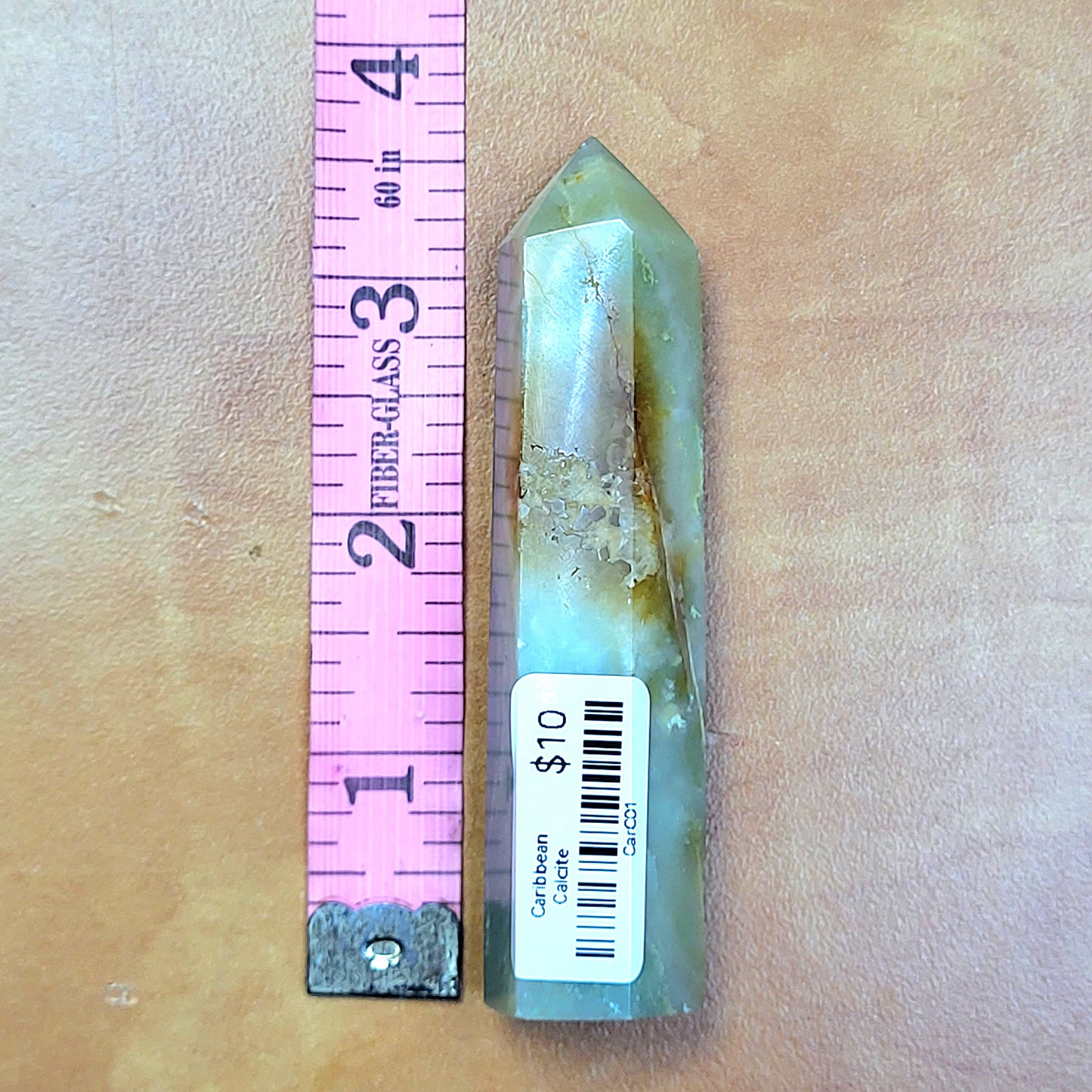 Caribbean Calcite towers with natural patterns and a smooth finish, measuring approximately 6 inches tall