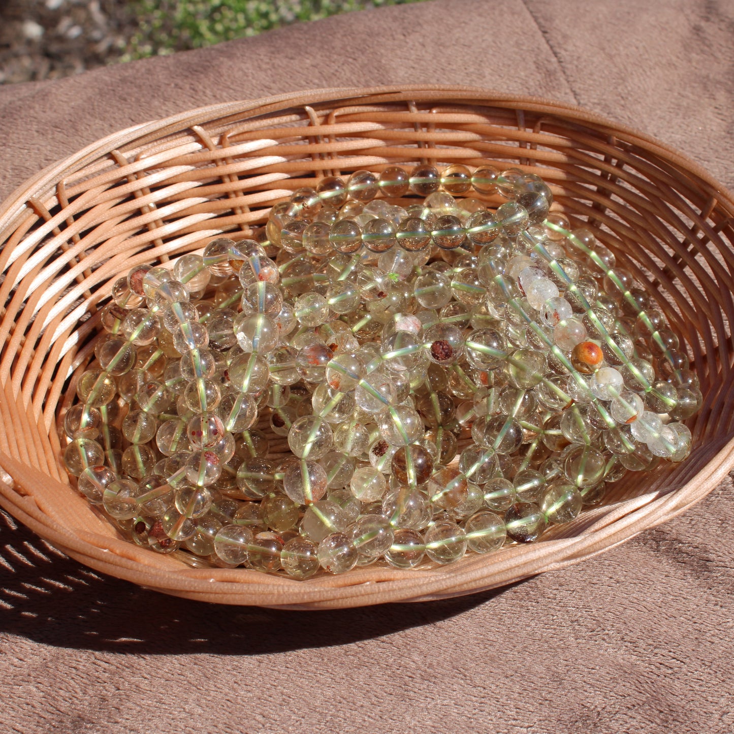 Collection of Clear Quartz Bracelets displayed in a woven basket for crystal enthusiasts