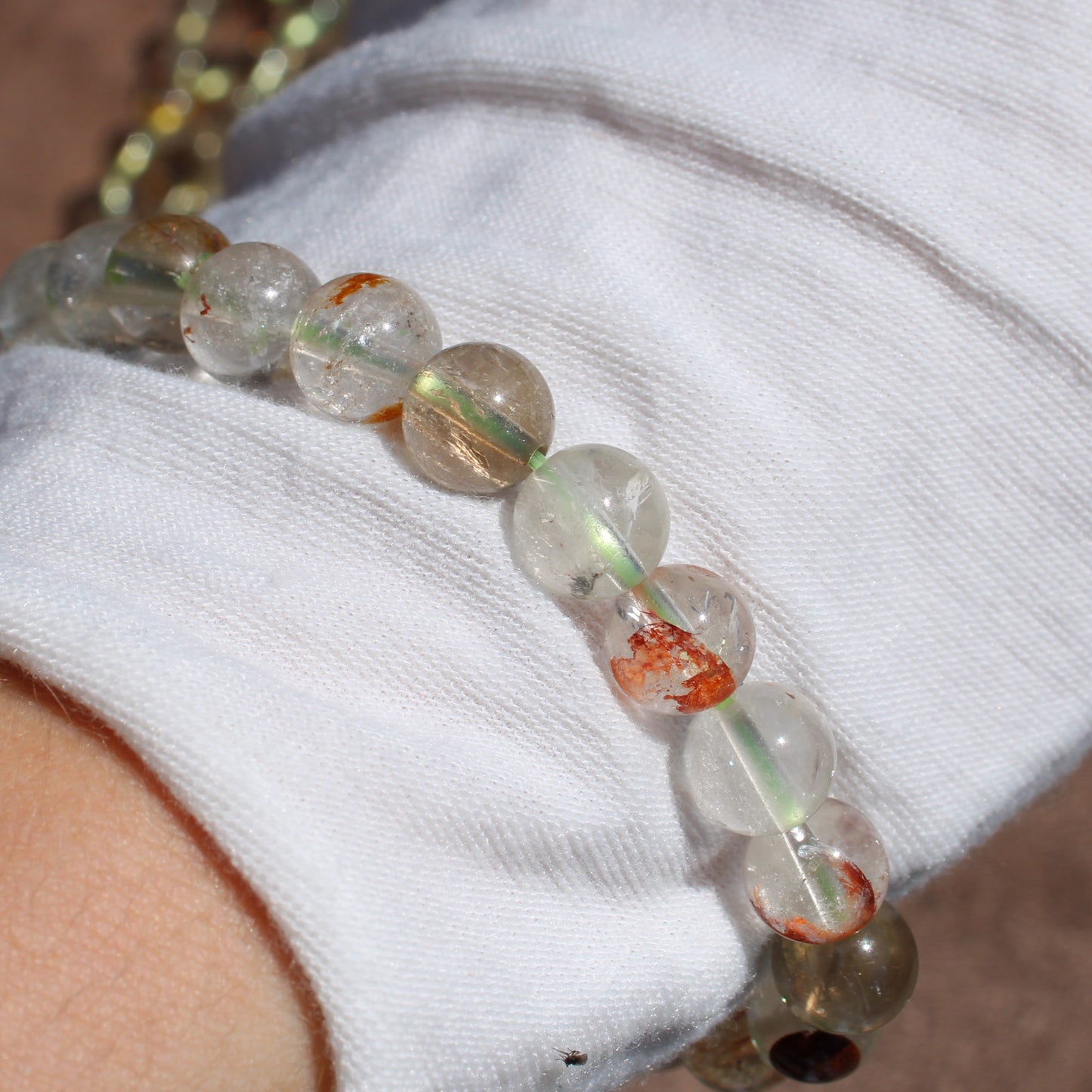 Close-up of a Clear Quartz Bracelet showcasing natural variations and unique patterns in the beads