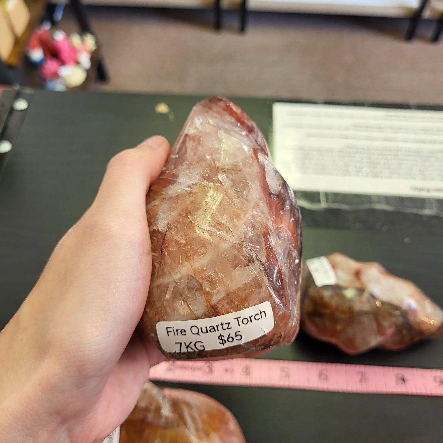 Hand holding a fire quartz torch crystal weighing 1 kg priced at 65 dollars from My Store