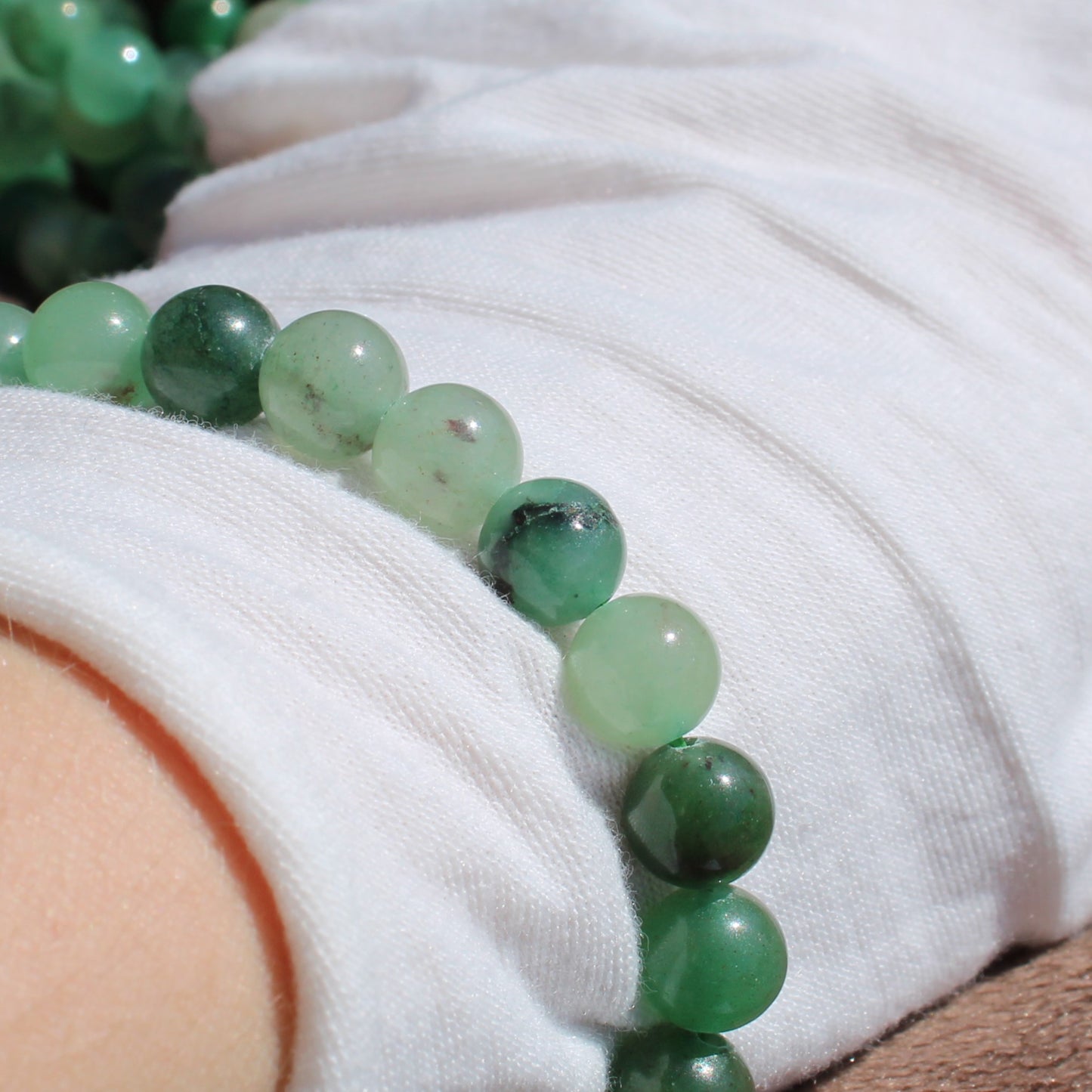 Green Aventurine Bracelet featuring smooth, shiny beads for stylish and healing wear
