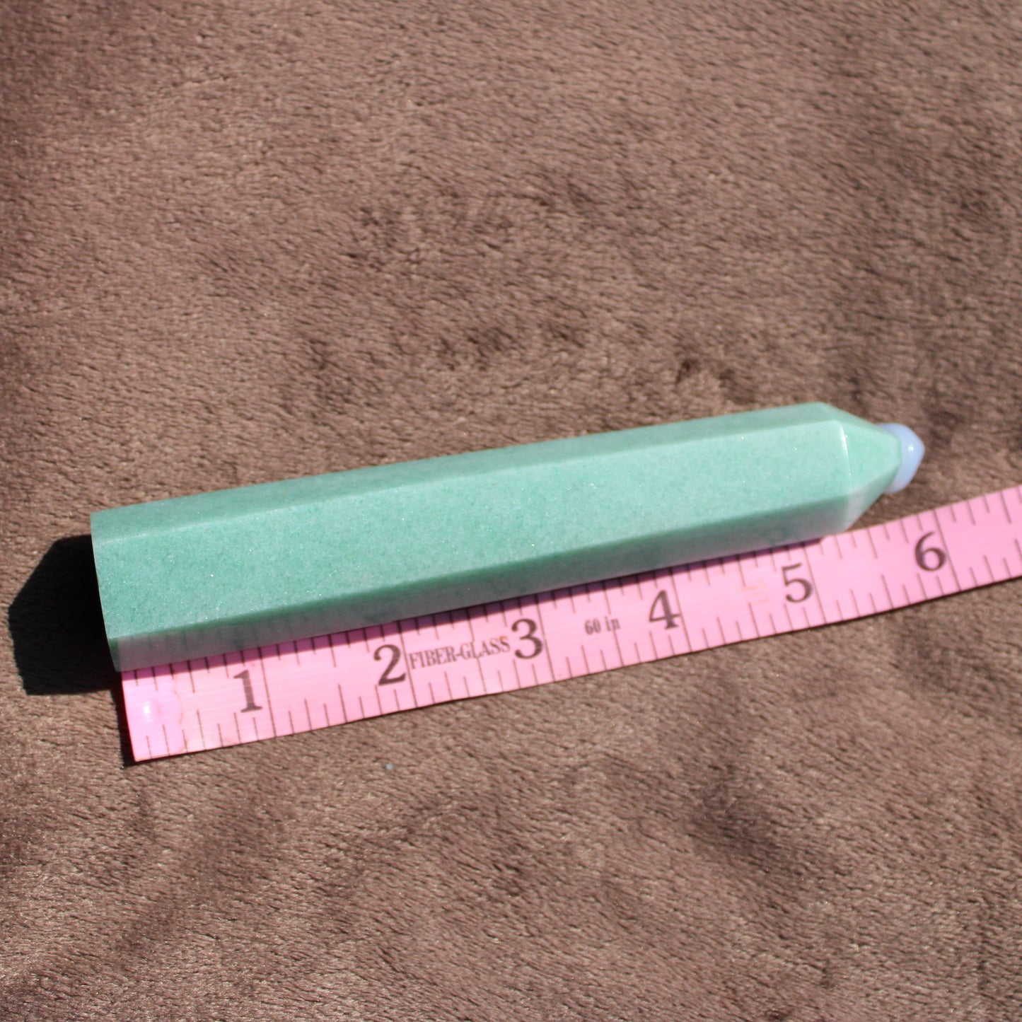 Green Aventurine tower with a smooth finish, measuring approximately 6 inches in length