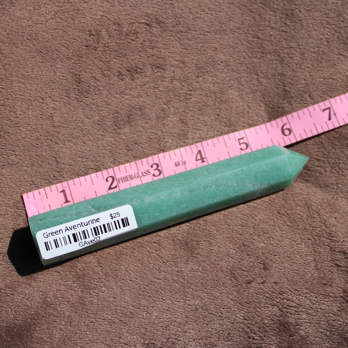 Green Aventurine tower with smooth surface, measuring approximately eight inches in length