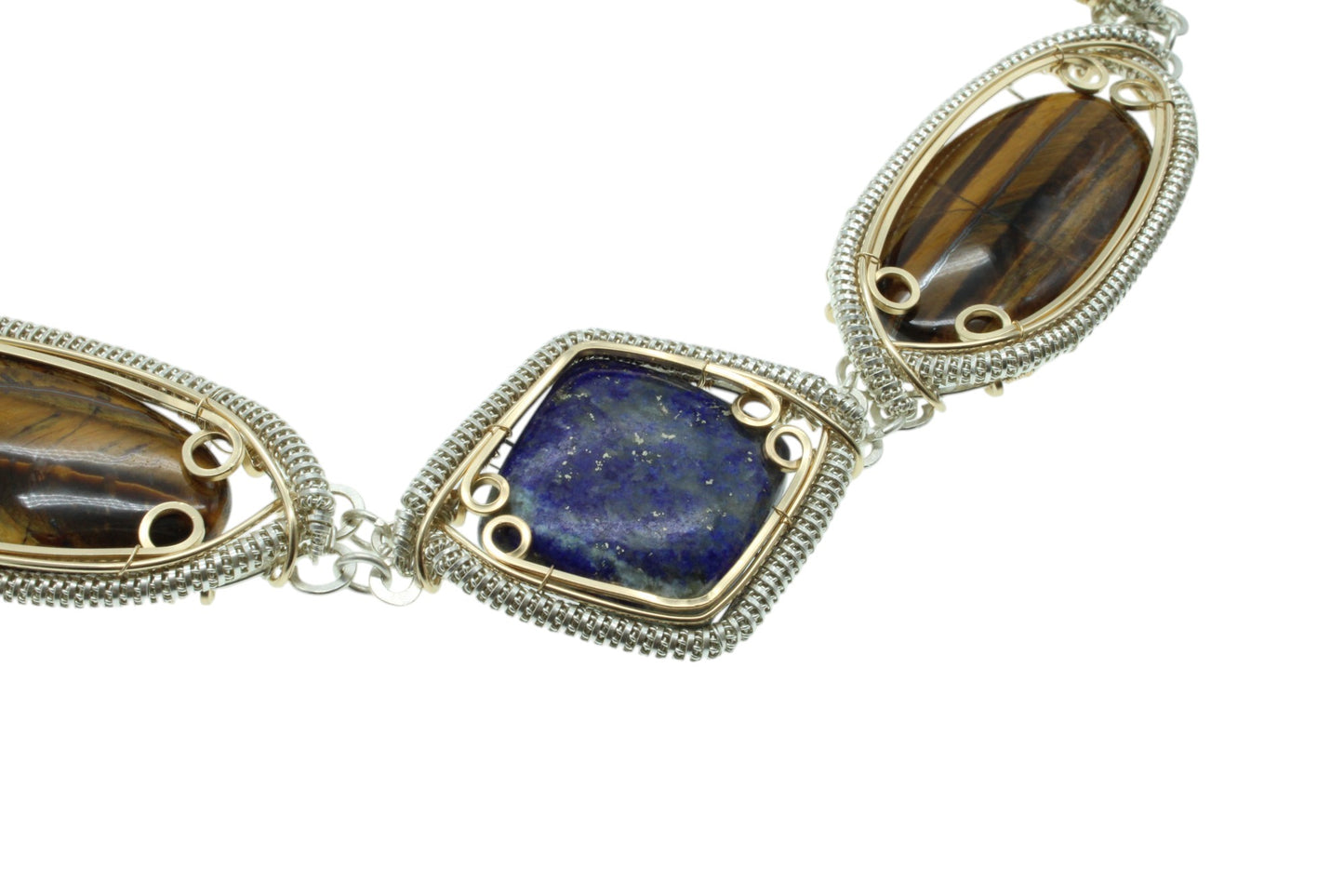 Handcrafted sterling silver necklace featuring unique lapis lazuli and tiger's eye gemstones