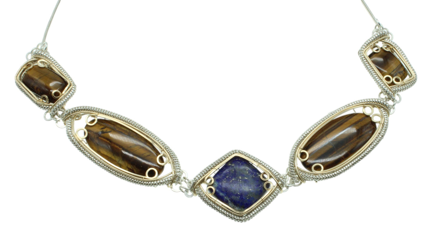 Handcrafted sterling silver necklace featuring intricate designs and natural gemstones