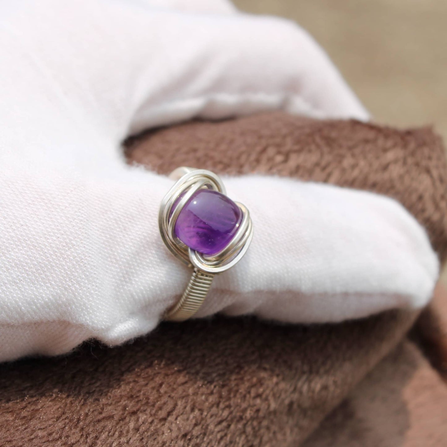 Handmade amethyst ring featuring a beautiful purple stone in a silver setting