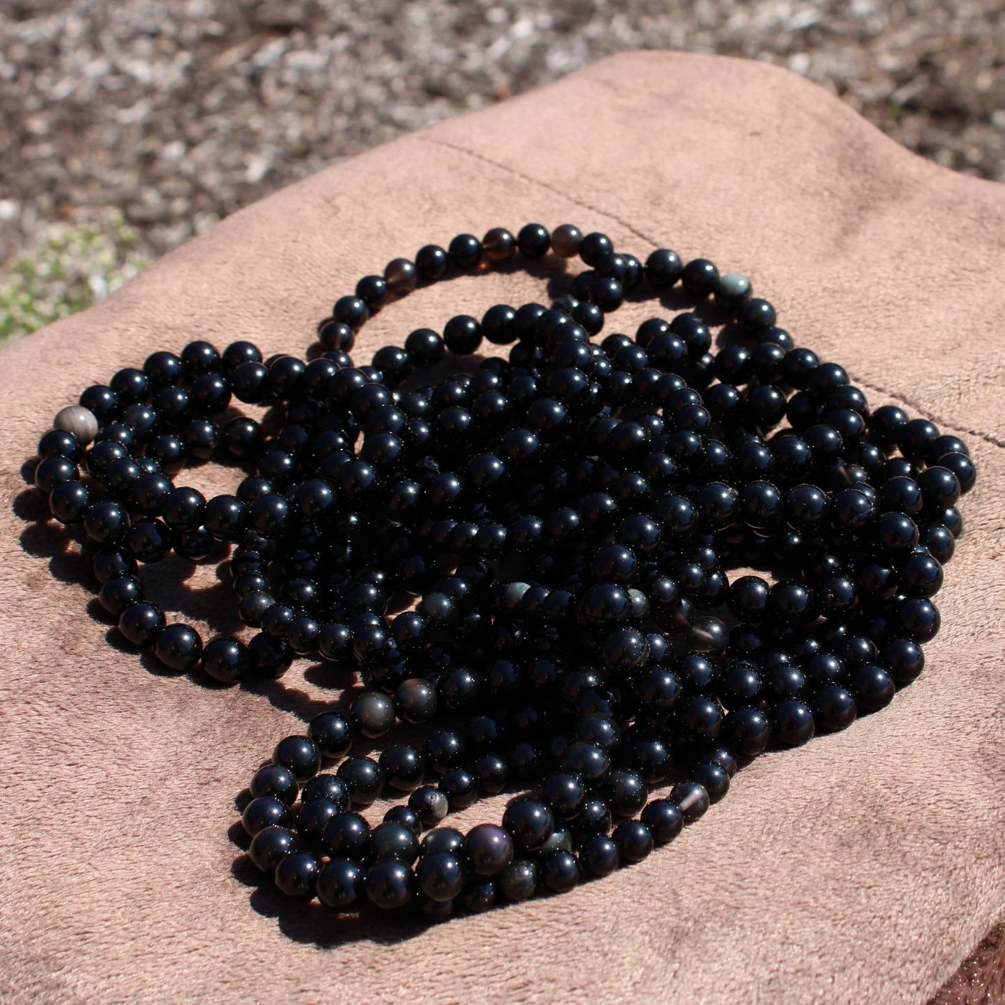 Handmade obsidian bracelet crafted with natural black beads for unique style and energy