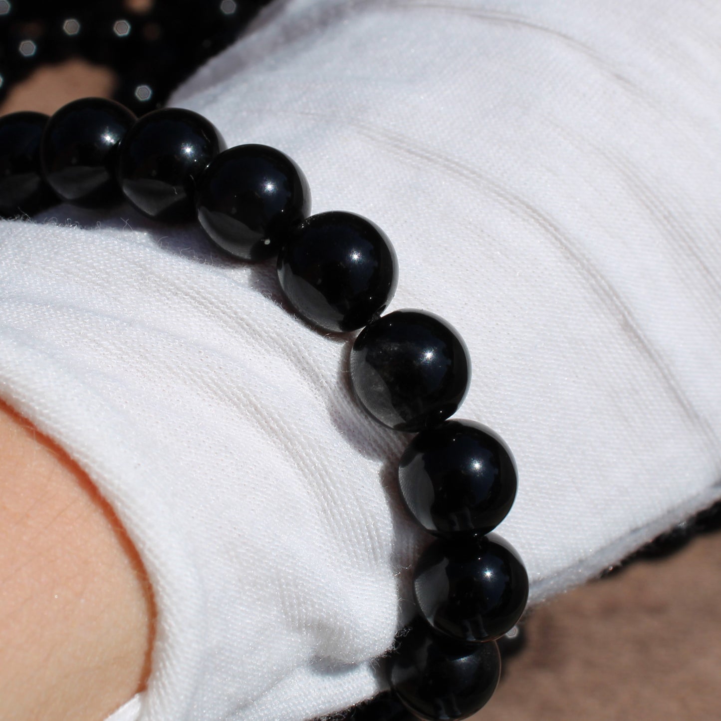 Handmade obsidian bracelet featuring polished black beads, perfect for everyday wear