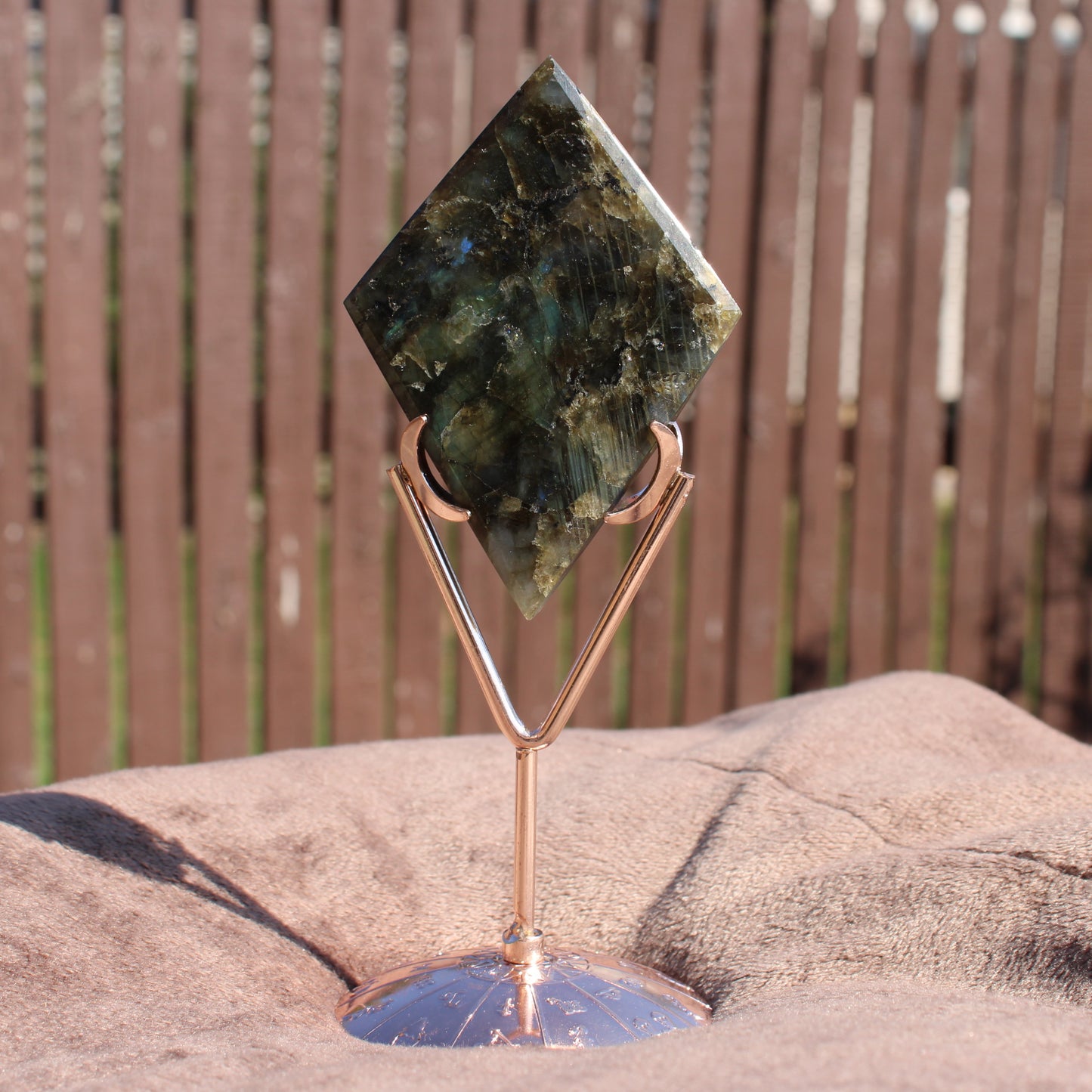 Labradorite Diamond Crystal Displayed on a Stylish Stand with Vibrant Color Patterns