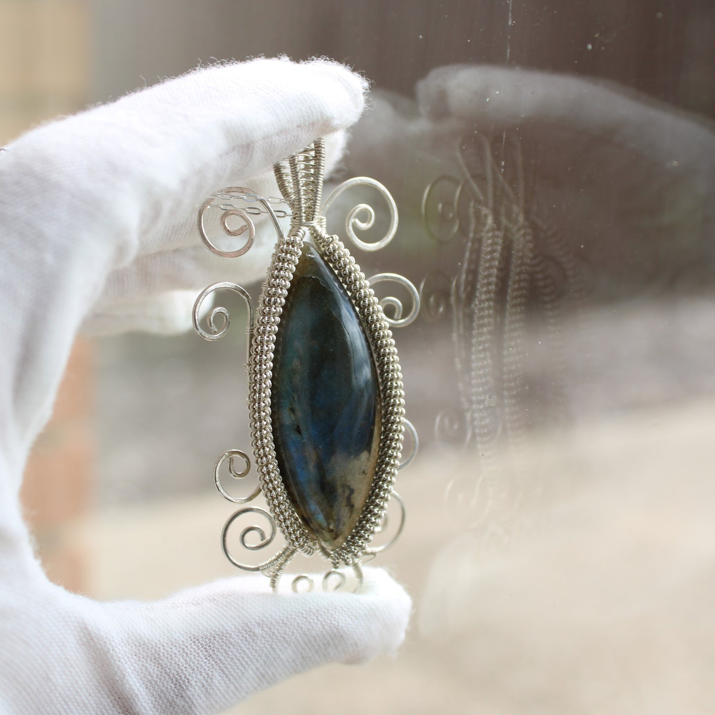 Labradorite Sterling Silver Swirl Necklace showcasing an intricate design with a stunning gemstone