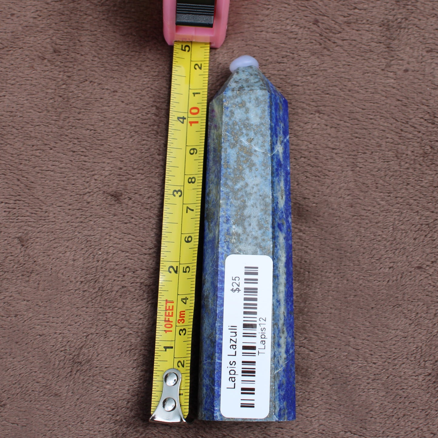 Lapiz Lazuli Tower crystal stone by Different Branches LLC next to tape measure showing size