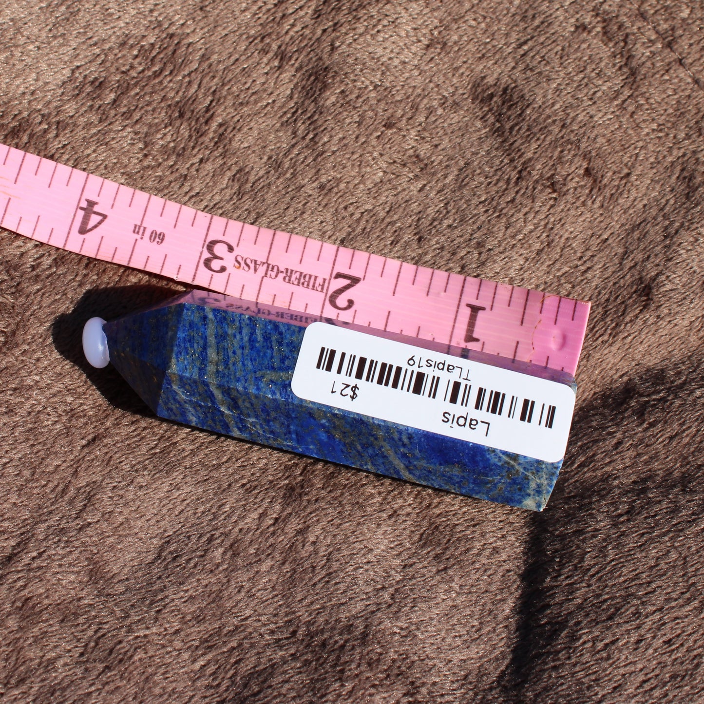 Lapis Tower Collection crystal measuring around 4 inches with vibrant blue hues and gold flecks
