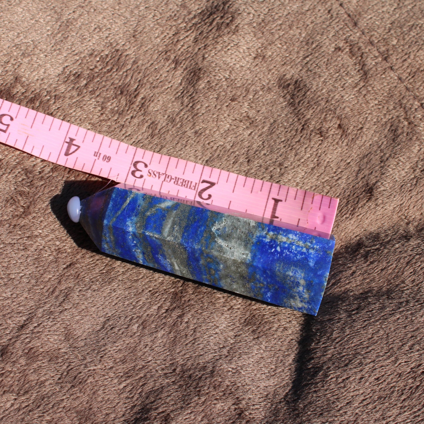 Lapis Tower Collection with vibrant blue hues and natural textures, measuring approximately six inches