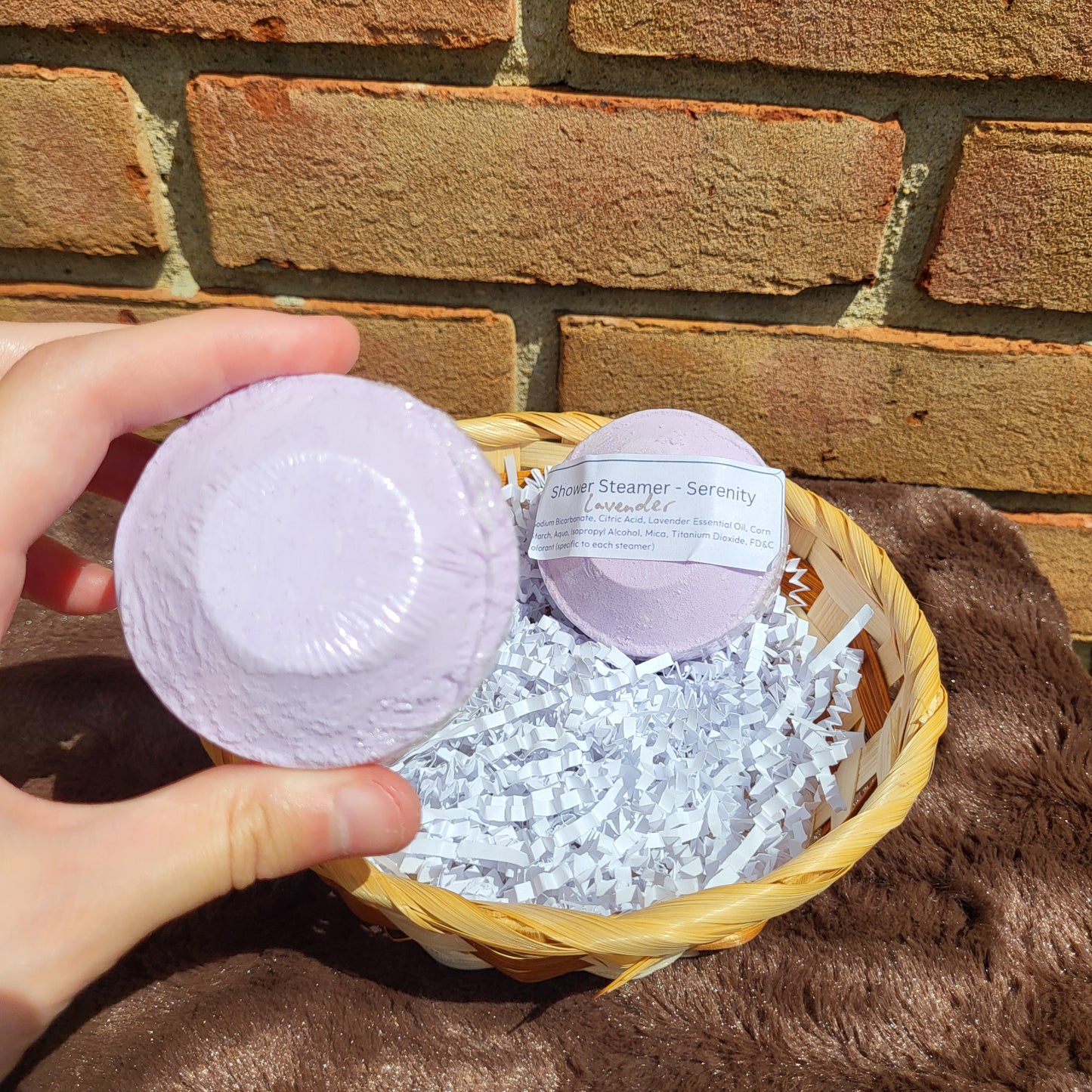 Lavender Shower Steamer from Made Natural in a decorative basket for a calming bathing experience