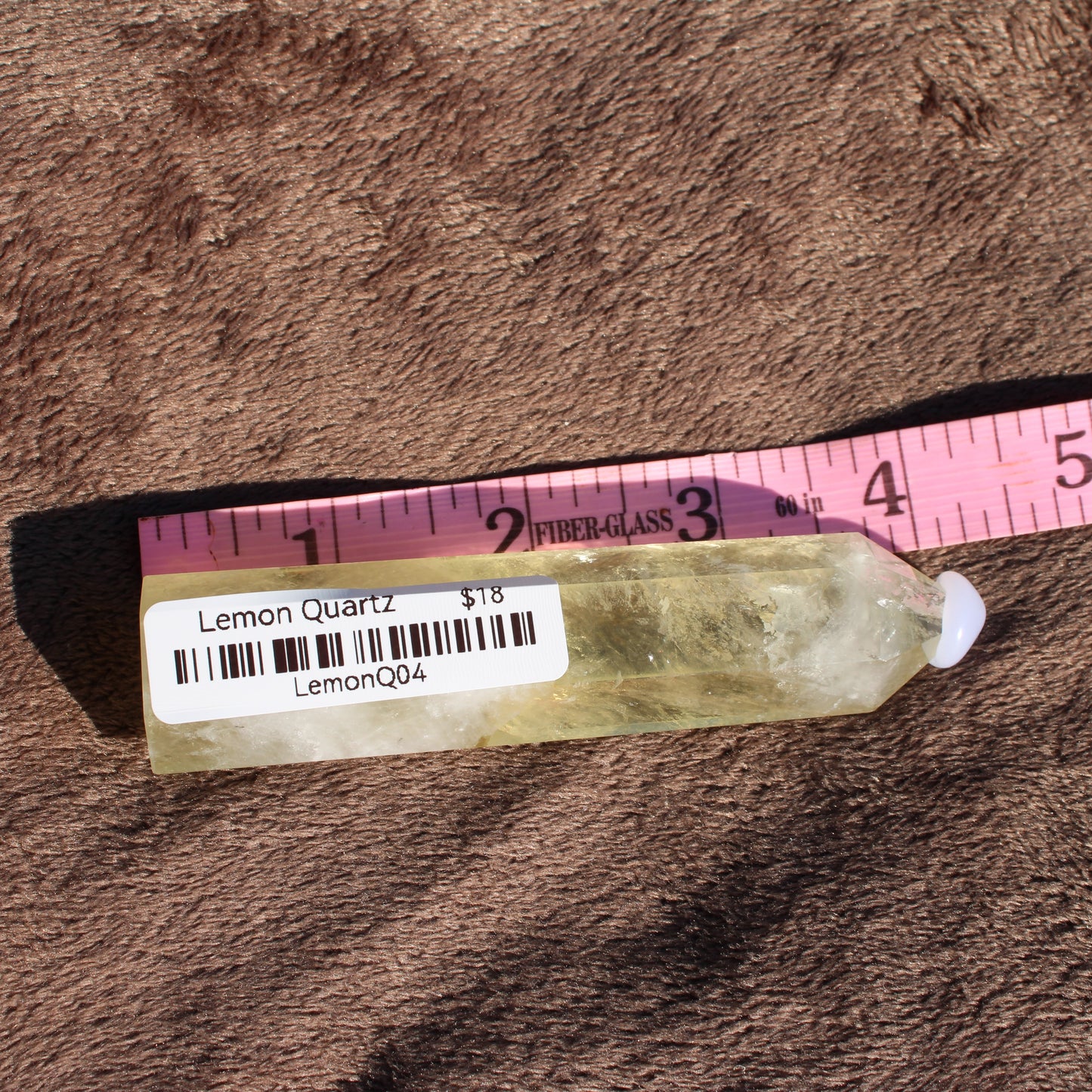 Natural Lemon Quartz Tower with a vibrant yellow color, perfect for crystal healing and decoration