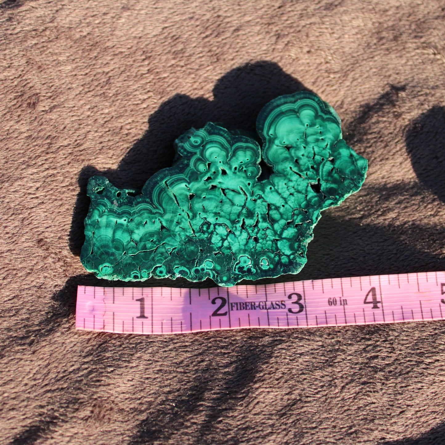 Beautiful Malachite slab featuring intricate green patterns and smooth textures for home decor