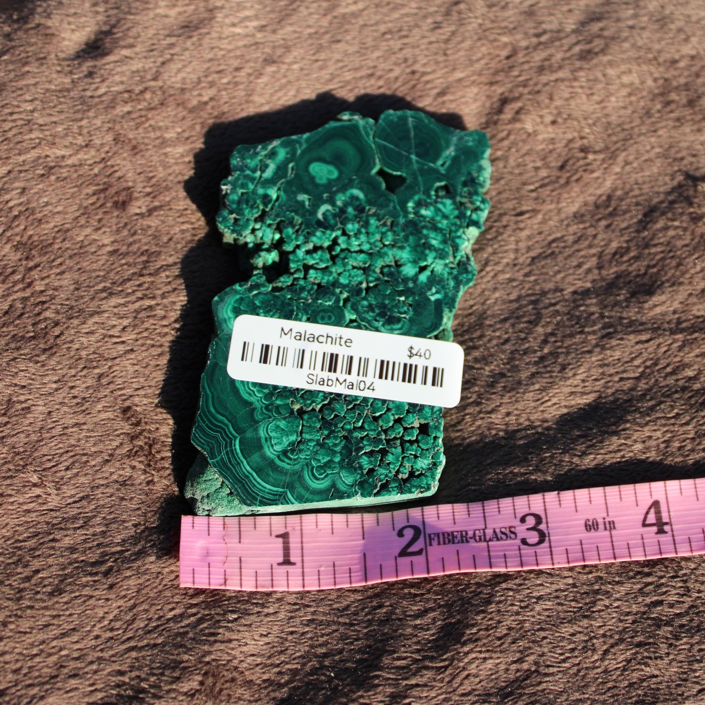 Beautiful Malachite slab with intricate patterns, ideal for jewelry or home decor projects