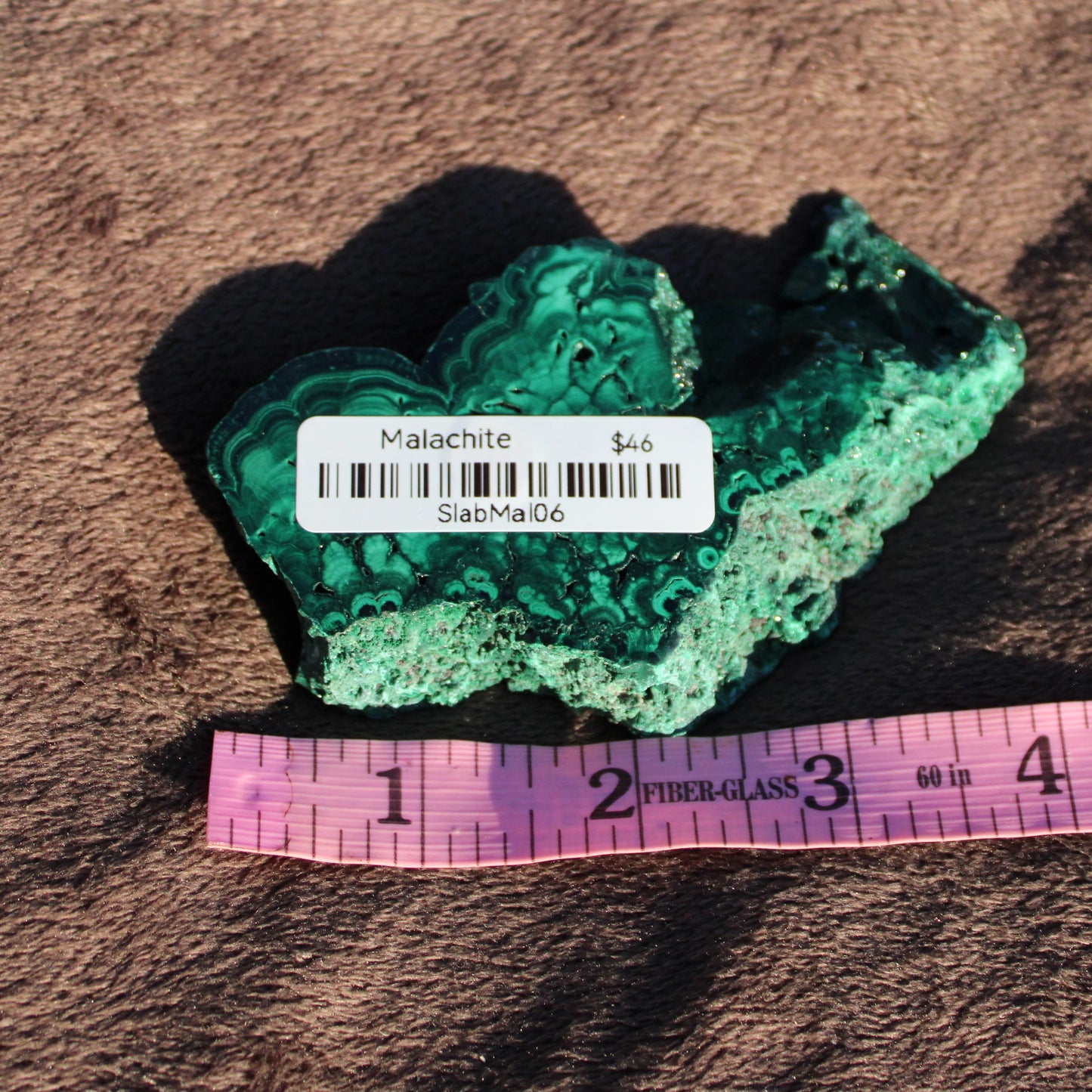 Natural Malachite slab displaying stunning green banding perfect for home decor or crafting