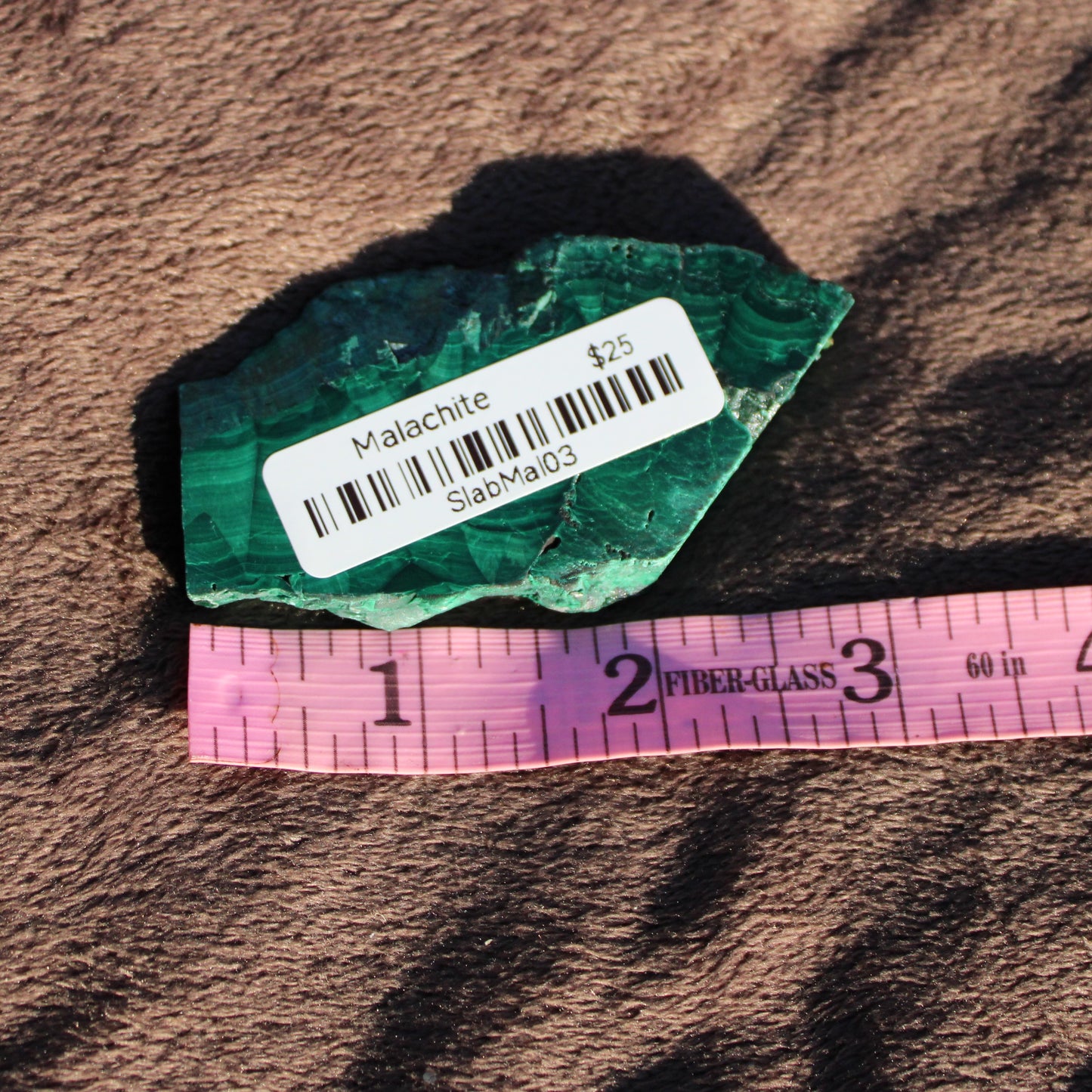 Natural Malachite slab with vibrant green patterns, perfect for healing and decorative use