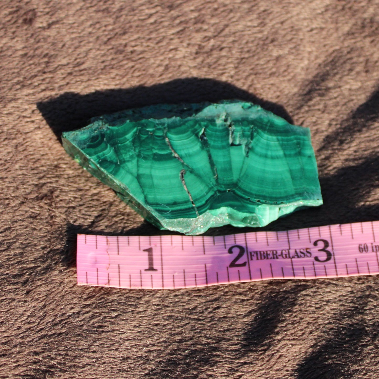 Natural Malachite slab showcasing rich green layers and unique patterns for mineral collectors