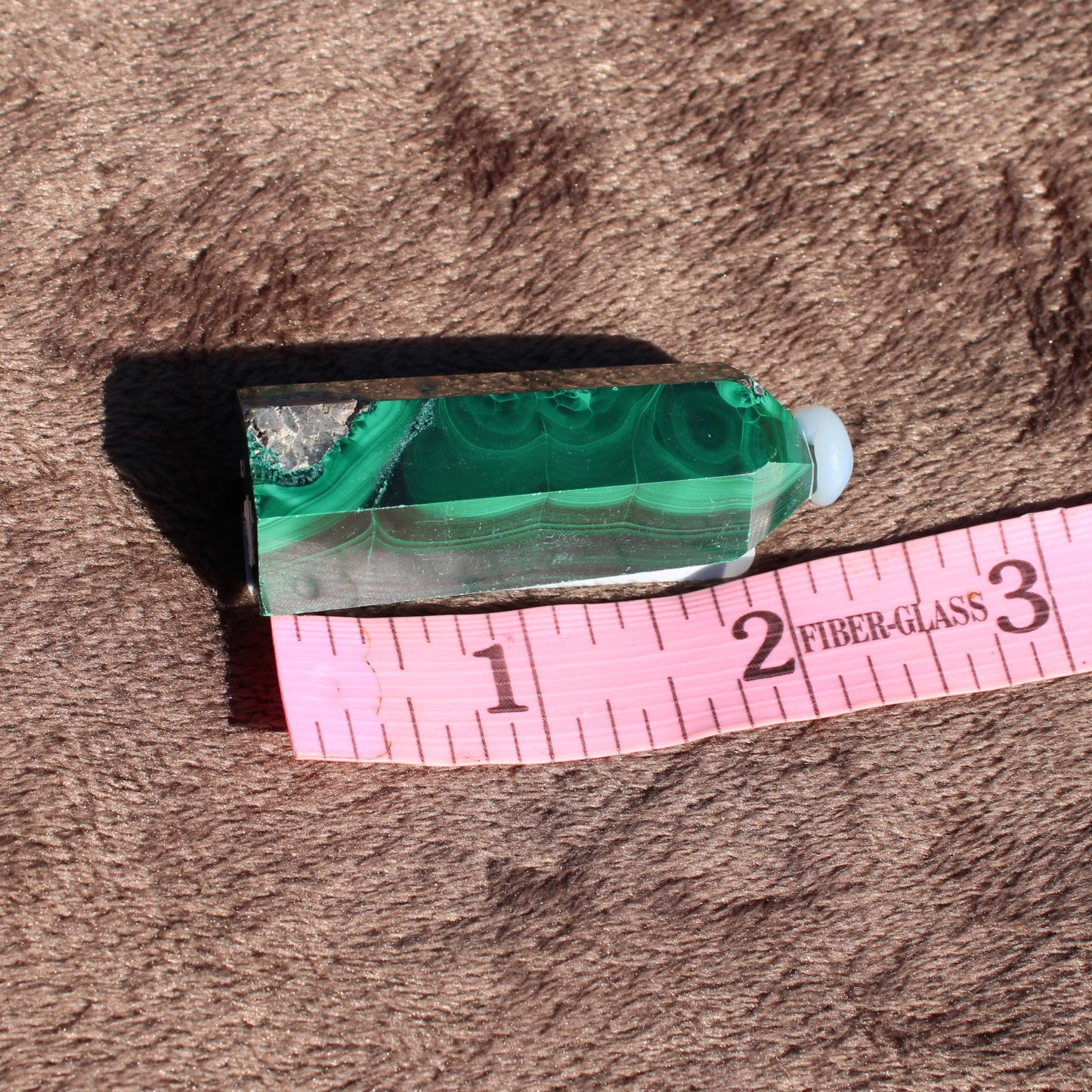 Malachite tower collection featuring a unique green crystal design with polished finish