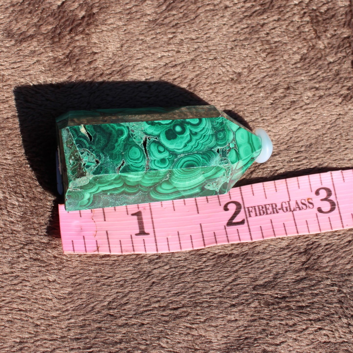 Unique Malachite tower collection crystal with rich green patterns and a smooth finish