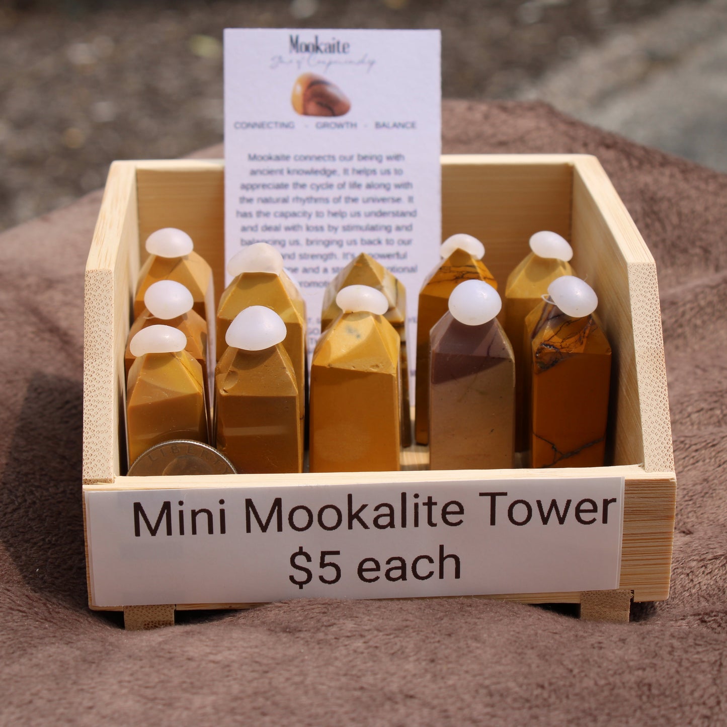 Mini Mookalite towers displayed in a wooden crate for sale at My Store, promoting balance and growth