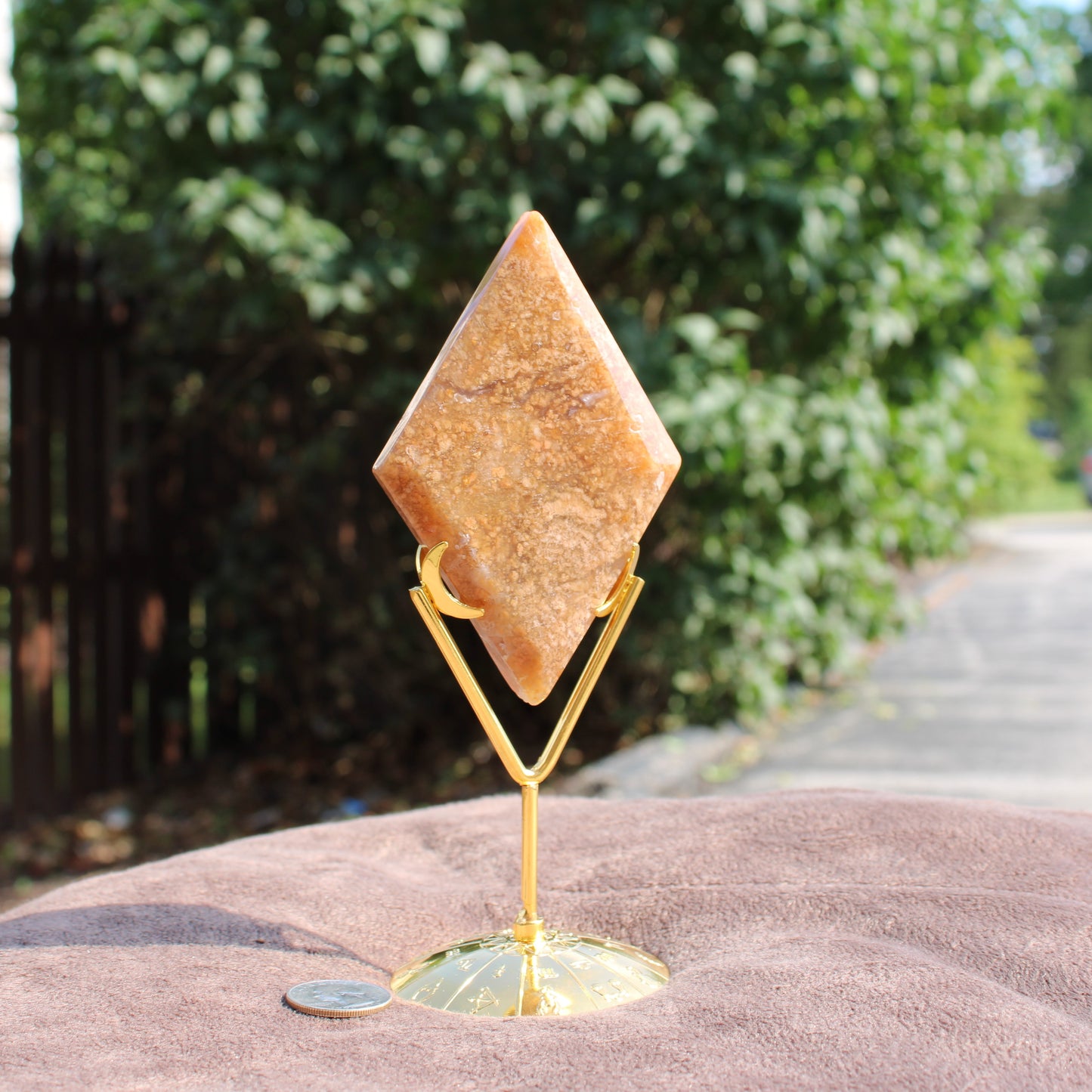 Moss Agate Diamond crystal with brown and beige tones on a gold stand by Different Branches LLC
