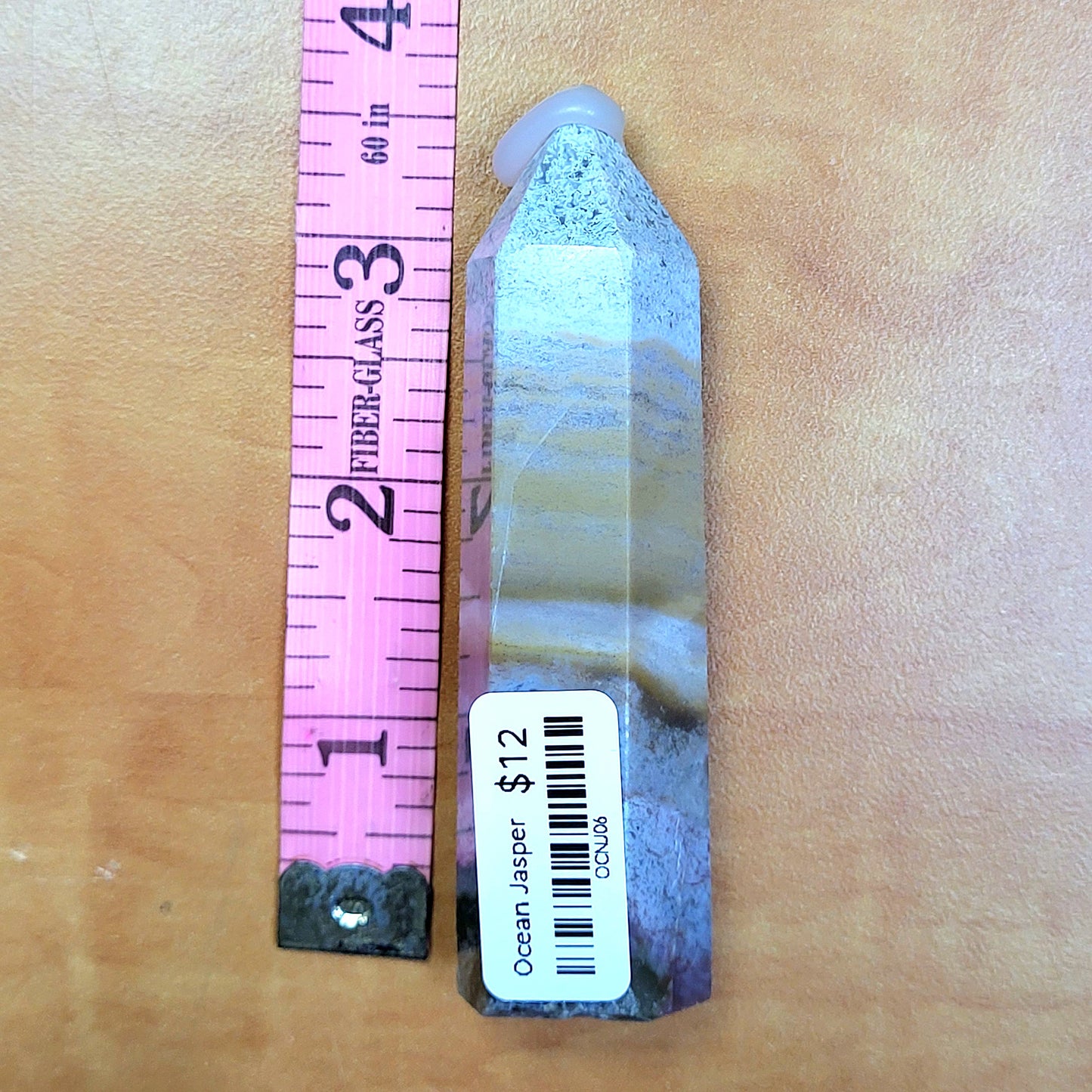 Ocean jasper tower with unique coloration, next to a ruler for size reference in My Store