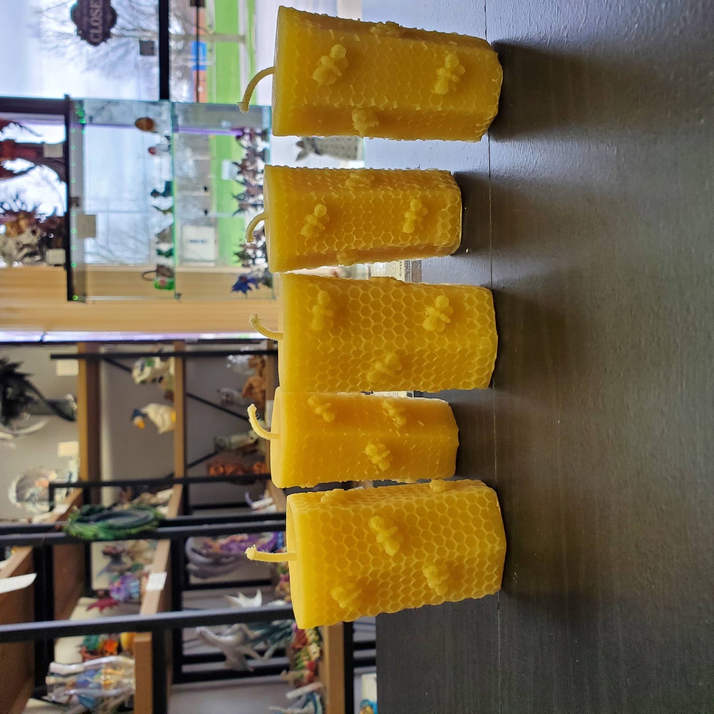 Pure beeswax honeycomb candles with textured design, perfect for natural ambiance