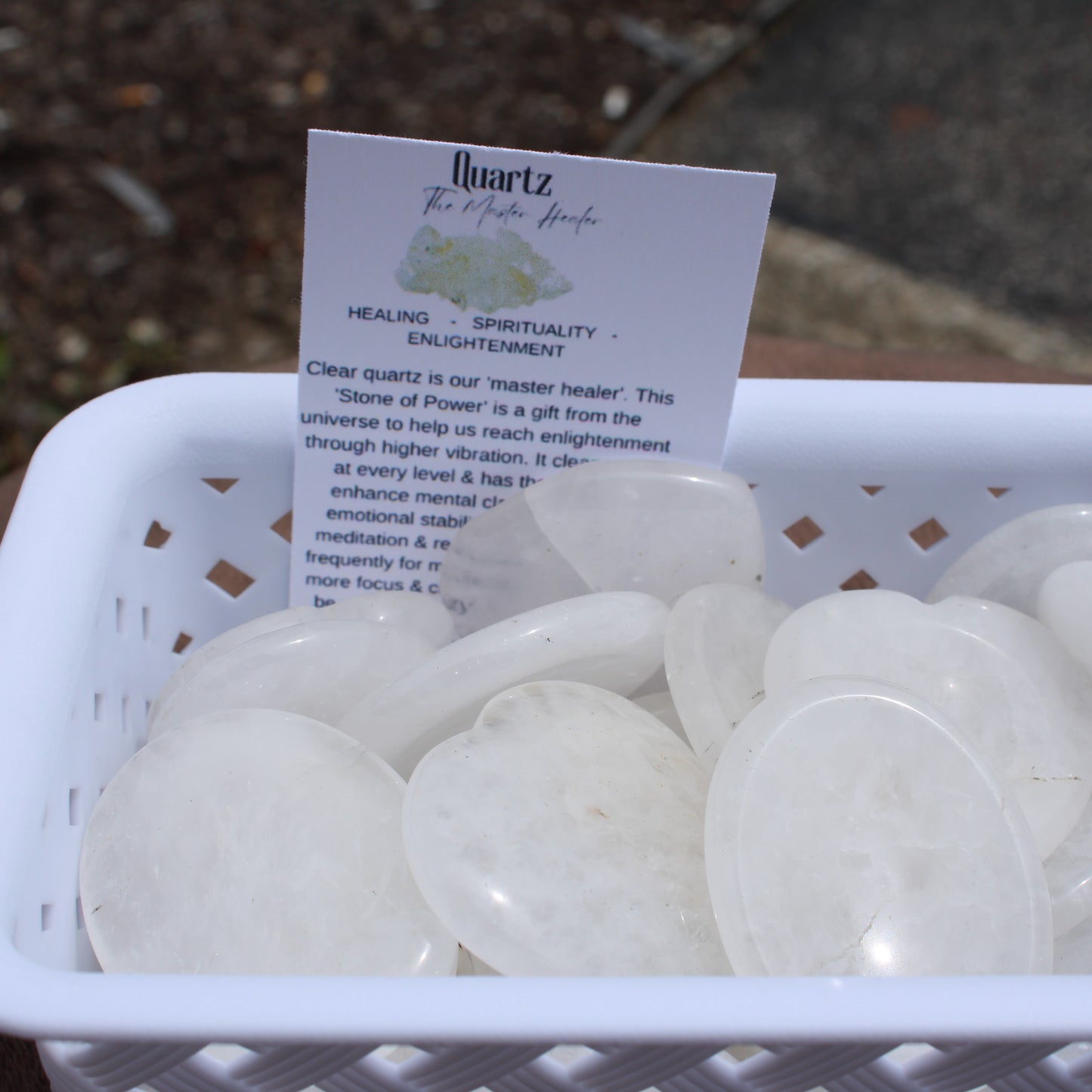 Clear Quartz Worry Stone polished smooth in white basket by Different Branches LLC