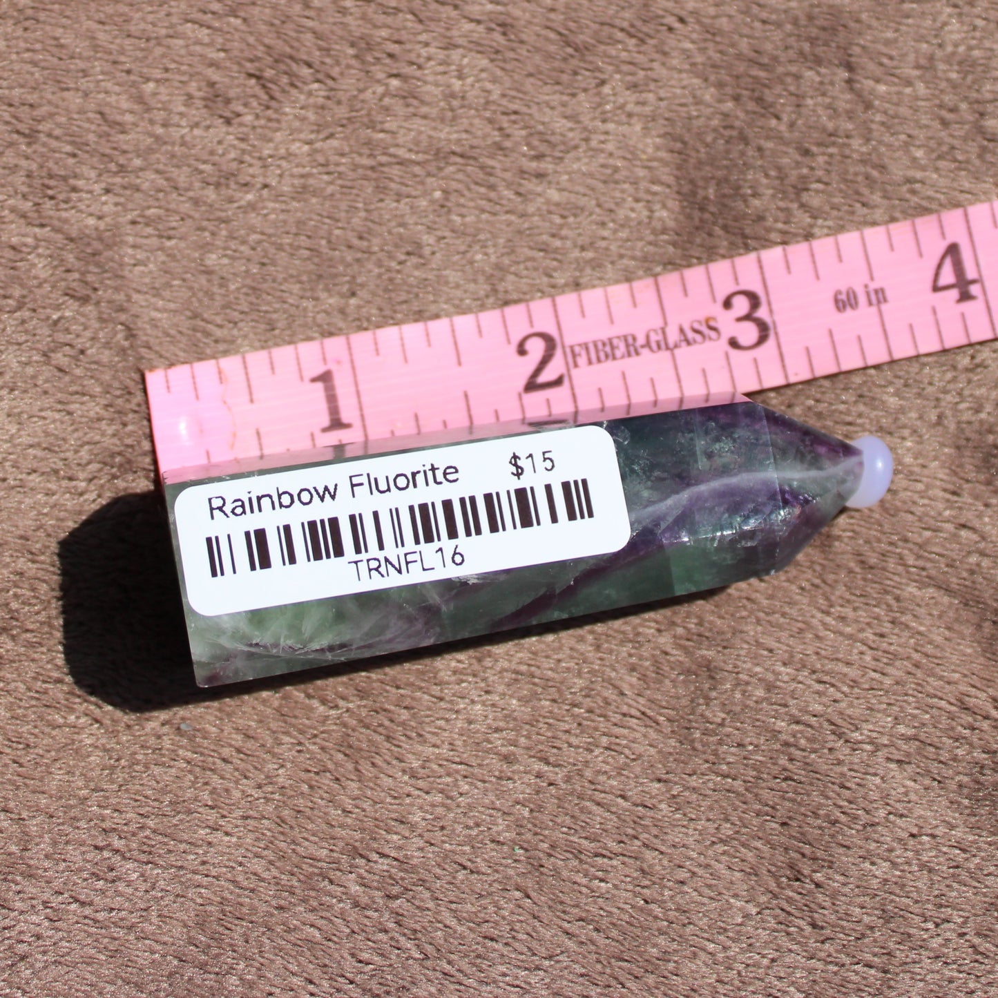 Rainbow Fluorite tower with a smooth finish, perfect for crystal healing and home decor