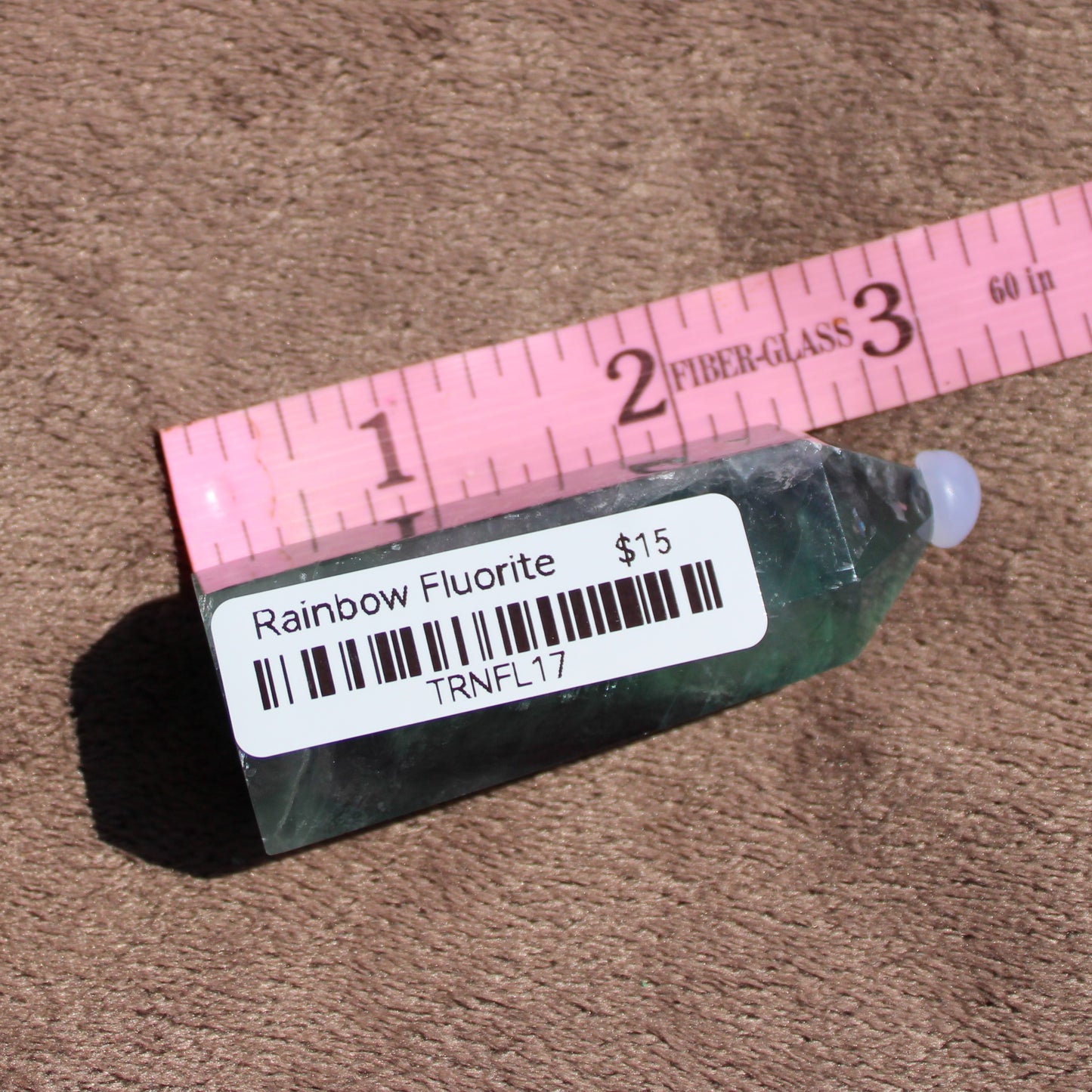 Rainbow Fluorite tower in green and purple hues for crystal enthusiasts or healing practices