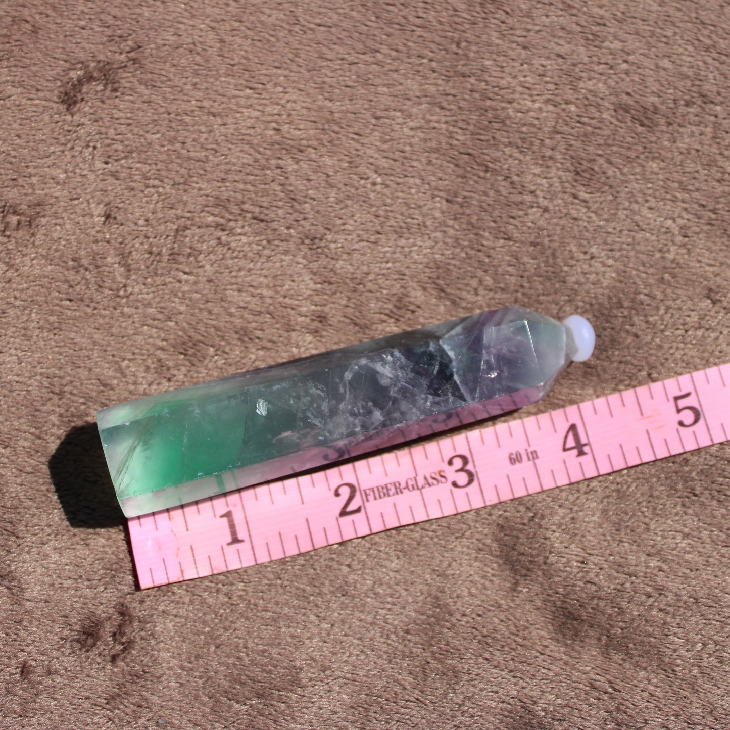 Rainbow Fluorite tower with vibrant green and purple colors, ideal for decor or crystal healing