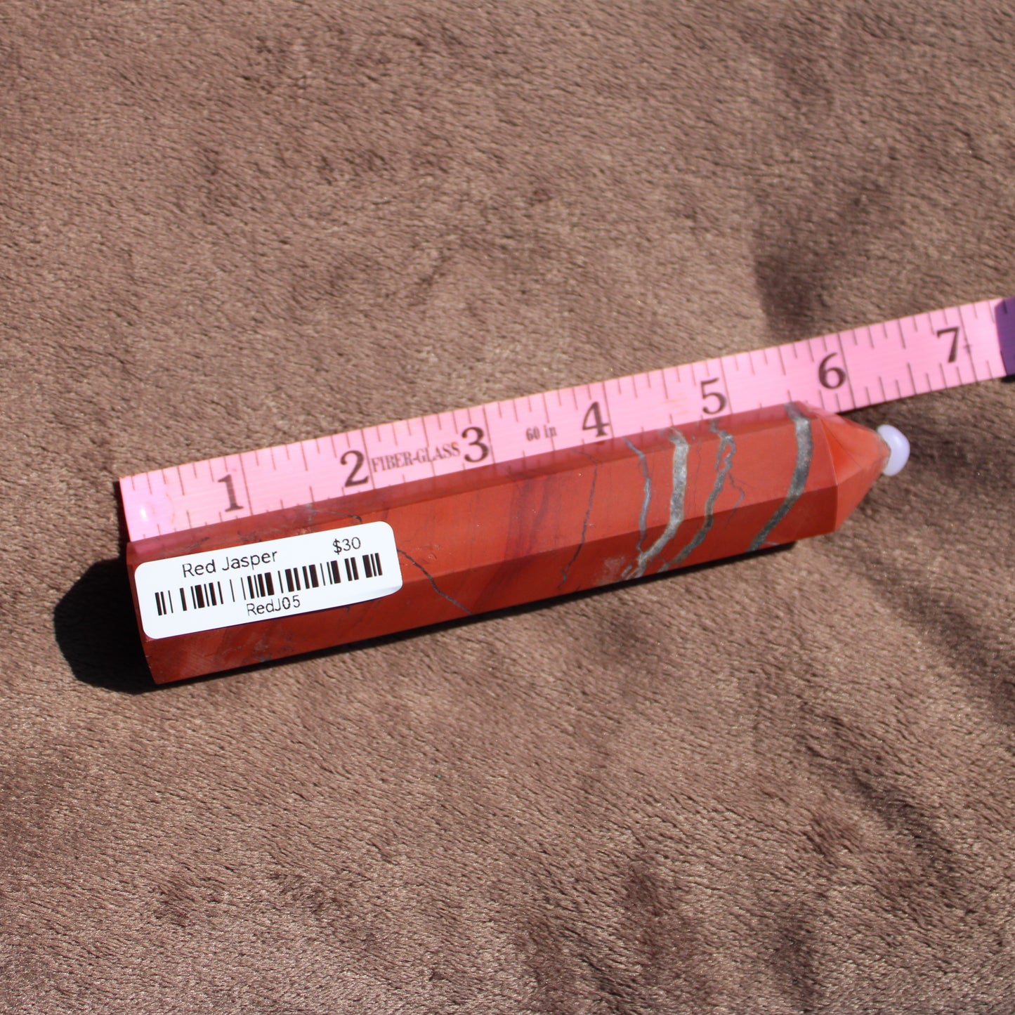 Red Jasper tower from Different Branches LLC with unique patterns and smooth edges
