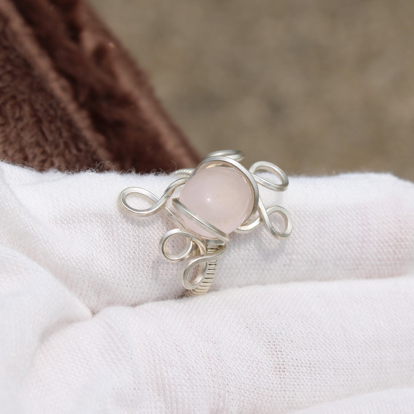Elegant rose quartz ring size 3 with a unique silver wire design, perfect for any occasion