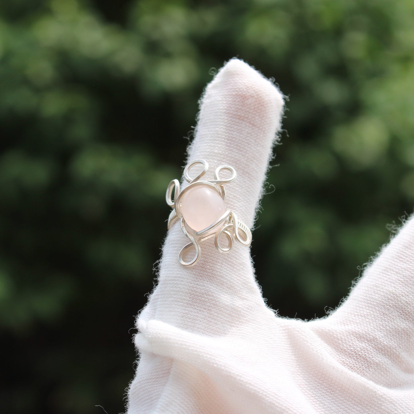 Elegant rose quartz ring size 3 set in intricate silver wire design for a timeless look